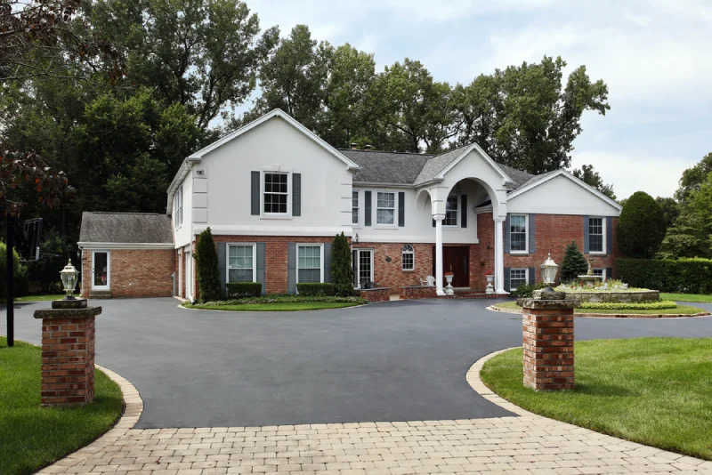 house with a brand new asphalt driveway